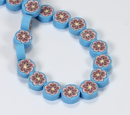 10 Stk. Fimo Perlen mit Blumenmuster Hellblau Münzenform 10x5mm
